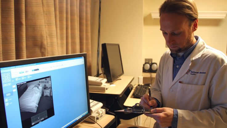 A sleep researcher at National Jewish Health in Denver monitors a patient who is sleeping without a CPAP mask, which is commonly used to treat sleep apnea. In a recent pilot study, experts showed patients video of themselves struggling to breathe during the night without their CPAP masks. After watching the dramatic, often disturbing videos, patient usage of CPAP masks increased considerably. Details: bit.ly/U4jfsQ